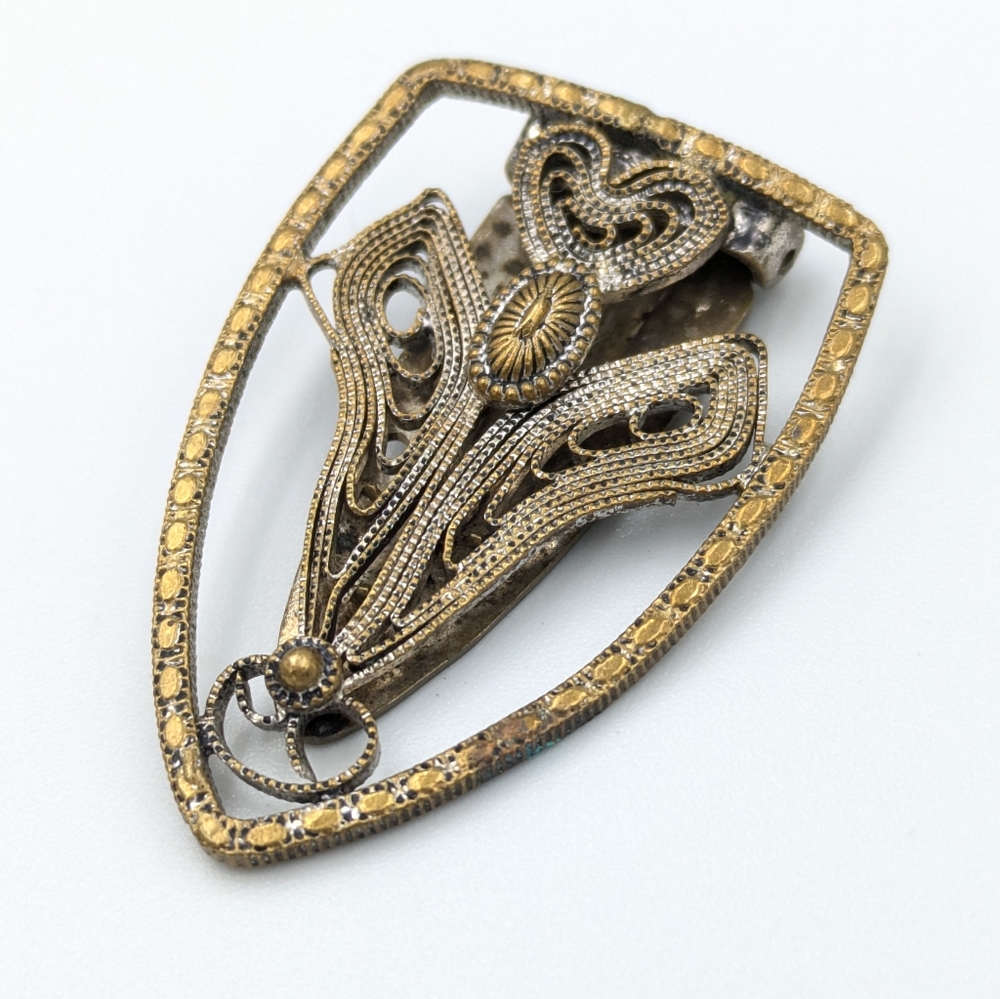 Antique metal work scroll dress clip